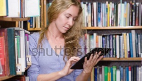 stock-photo-young-focused-student-using-a-tablet-computer-in-a-library-172424981.jpg