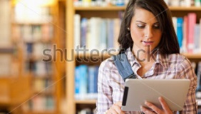 stock-photo-young-focused-student-using-a-tablet-computer-in-a-library-84634318.jpg