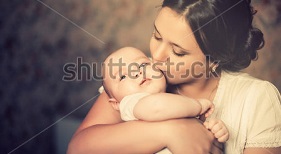 stock-photo-young-mother-kissing-her-little-newborn-baby-137703866.jpg