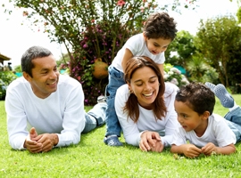 young-family-playing-in-grass-montage.jpg
